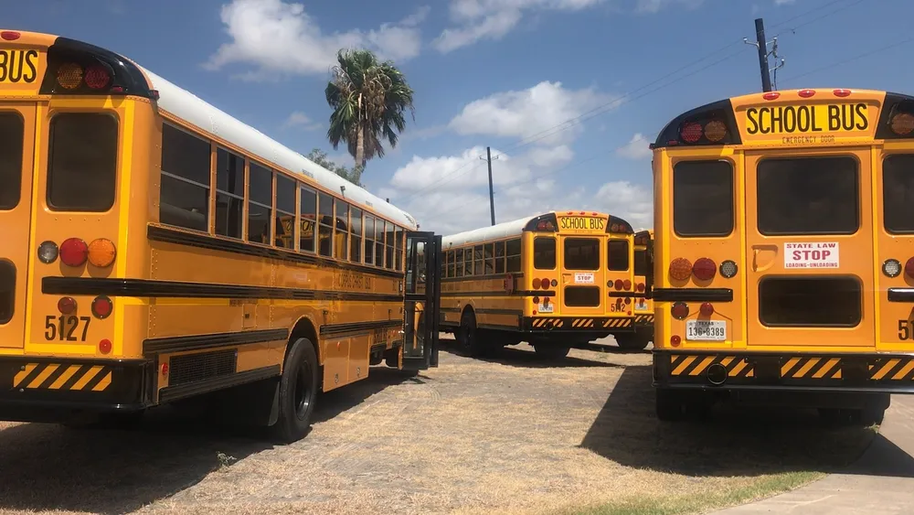 Yellow school buses parked at a depot